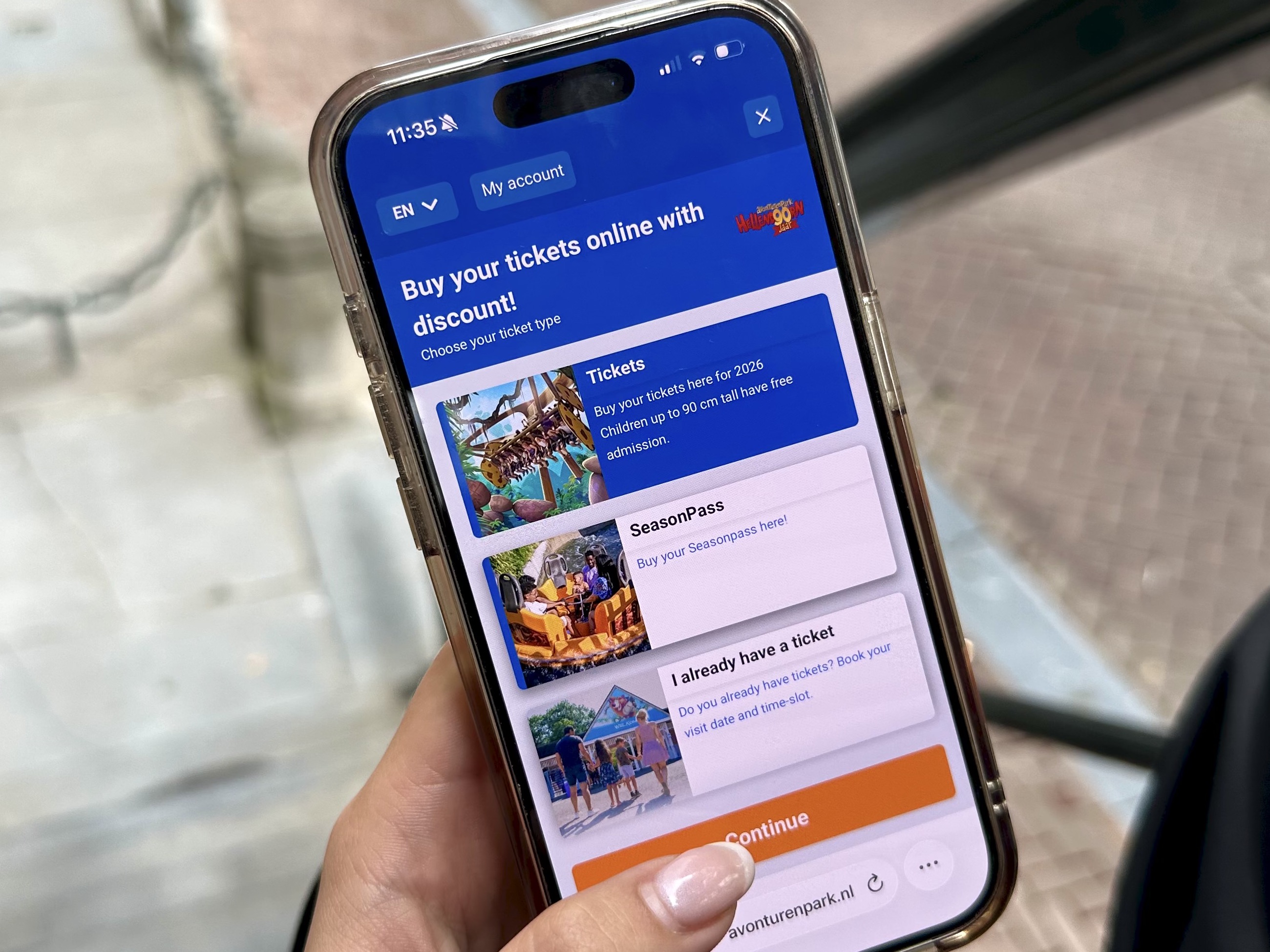 A guest buying tickets on the Convious checkout open on their phone at a venue